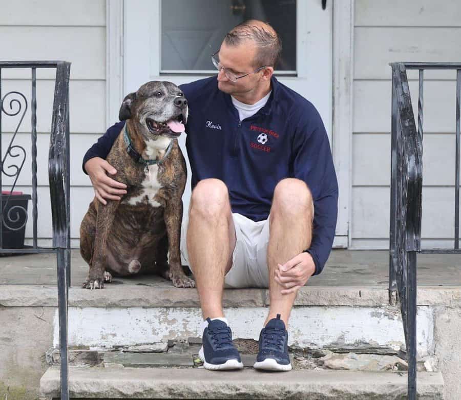 photo of Mellow, a dog with terminal cancer, and his owner